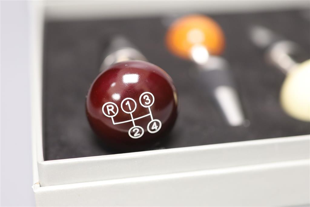 A cased novelty Mercedes Benz four-piece gear stick wine stopper set